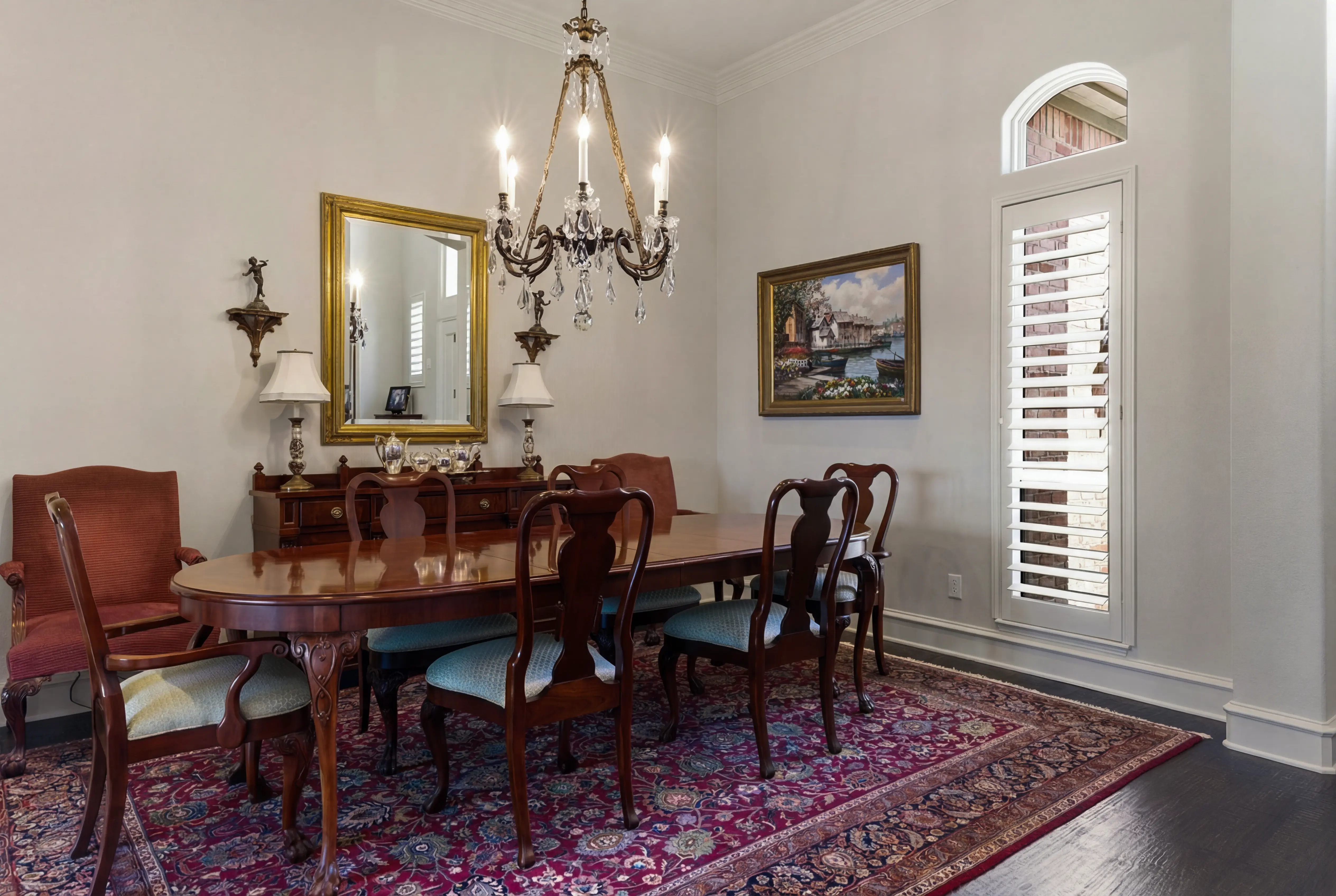 Formal dining room with chandelier and hardwood floors
